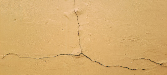 crack in orange wall	
