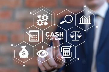 Business man using virtual touch screen presses inscription: CASH COMPLIANCE. Cash Compliance...
