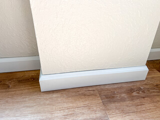 Installing Vinyl Baseboards in a Modern Home Renovation Project - 786757461
