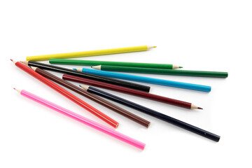 a messy pile of colorful pencil crayons isolated on white