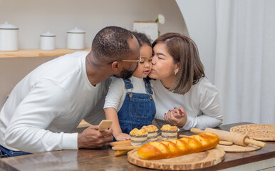 Multiracial Family Spending Quality Time Together Baking Bread in a Cozy Kitchen Setting