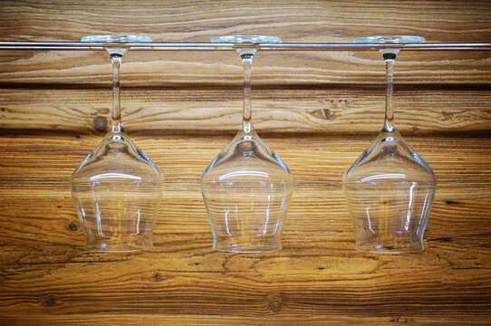 Wine glasses hanging on the counter - Powered by Adobe