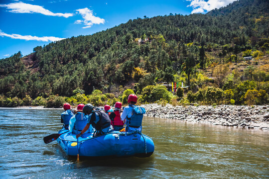 Punakha, Bhutan - Tourists ride on the rafting facility, providing an interesting experience for travel enthusiasts