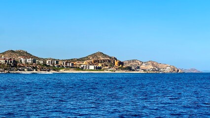 Scenic view of a town on a hill by the sea