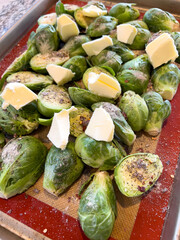Fresh Brussels Sprouts with Butter Chunks Ready for Roasting