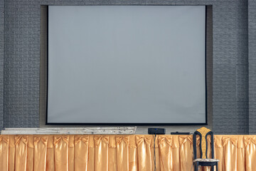 Empty stage with projection screen