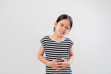Cute little girl asia suffering from stomach ache,