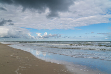 View of the incoming wave on the Baltic Sea on the shore of the Curonian Spit on a summer day, Kaliningrad region, Russia
