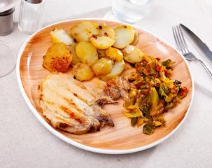 Plexiglas foto achterwand Appetizing grilled pork with delicious fried potatoes and stewed cabbage with vegetable © JackF