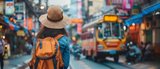 A tall giraffe leisurely strolling on a city street, adorned with a stylish hat and carrying a backpack