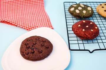 Various Homemade Tasty Cookies With Choco Chips Over Blue Background