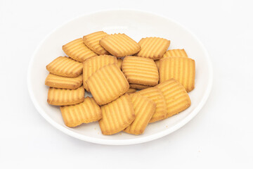 Pakistan favorite biscuits in a plate on white background with copy space.