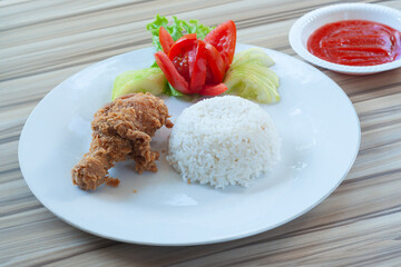 Fried Chicken with white rice and Vegetables as garnish