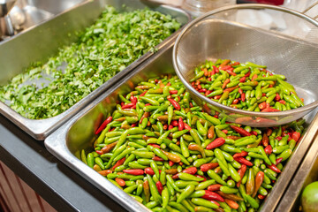 Green and red peppers in a tray