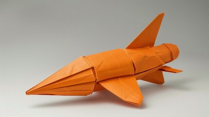 Detailed origami rocketship in orange, showcasing precision and creativity AI Generative.
