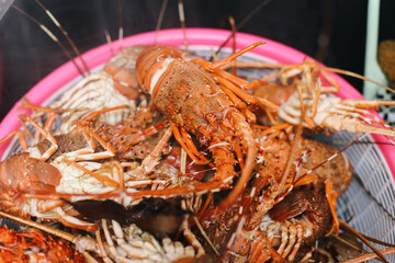 Many Cooked Lobster in a Container at The Kitchen