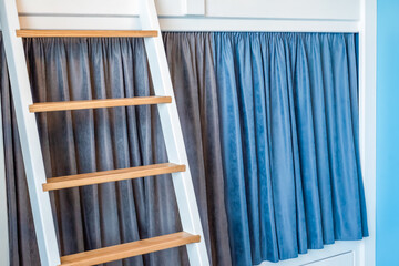 Blue curtains for bunk bed for boys in the bedroom without people