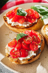delicious Italian bruschetta with tomatoes on a light stone background