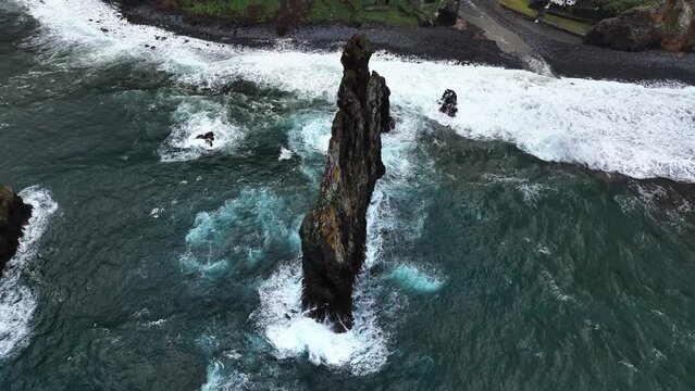 Aerial view rising around the Ilheus da Rib, cloudy day in Ribeira da Janela, Madeira