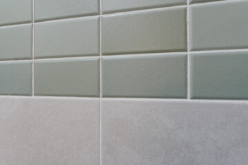 Mint colored tiles above, gray tiles below