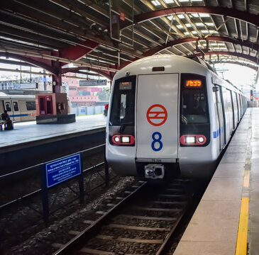 New Delhi, India, February 17 2024 - Delhi Metro train arriving at Jhandewalan metro station in New Delhi, India, Asia, Public Metro departing from Jhandewalan station