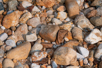 Stone wall background, Different color beach stones background.
