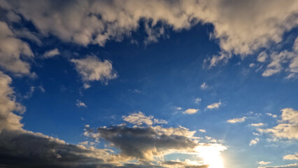 Fototapeta na wymiar nice sunset golden clouds on the sky backdrop - photo of nature
