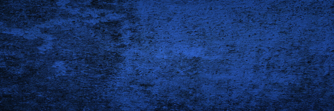 Dark blue background with grunge cement or concrete texture