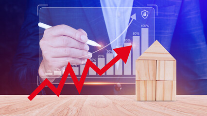 a red up arrow and wooden house. The concept of the rising price of real estate, high demand for...