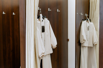 Dressing room with curtains in a clothing store, in fashionable women's clothing store, in...
