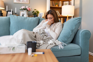 Cold And Flu. Portrait Of Ill Woman Caught Cold, Feeling Sick And Sneezing In Paper Wipe. Closeup Of Beautiful Unhealthy Girl Covered In Blanket Wiping Nose. Healthcare Concept.
