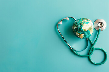 Stethoscope Encircling a Globe on a Blue Surface, Representing the Interconnectivity of Global Health