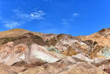 Fototapeta na wymiar Death Valley National Parks colorful rainbow hills of Artists Pallette were formed by volcanic deposits of different compositions.