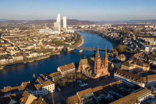 Basel, Switzerland: Aerial view of Basel old town, the cathedral and office tower along the Rhine river in late afternoon in  Switzerland thrid largest city.