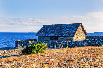 Old stone boathouse on the shore - 786879244