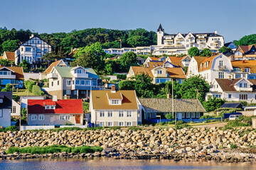 Detached houses on a hill by the sea in Sweden - 786879431