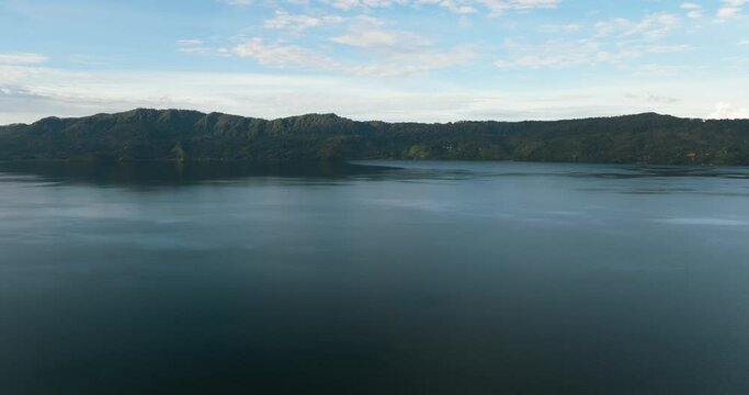 Top view of lake Toba among the mountains with rainforest. Sumatra, Indonesia.