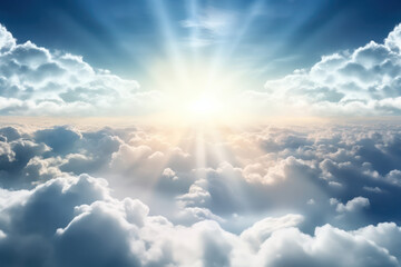Beautiful view of the sky with clouds and sun rays shining through, creating an ethereal atmosphere.