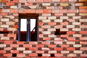 Window to the sky between bricks
