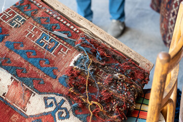 Detail of yarn ends of carpet during restoration threadbare