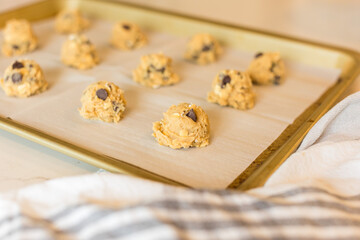 Oatmeal chocolate chip cookie dough on baking sheet