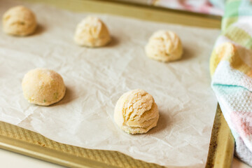Sugar coated cookie dough on baking sheet