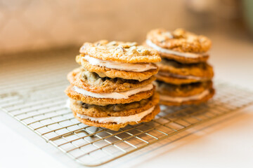 Stacks of oatmeal cream pies on a cooling rack