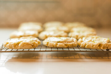 Side view of lime cookies on a cooling rack