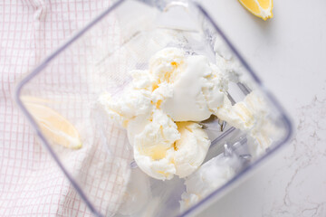 Blender full with ice cream for lemon milkshake
