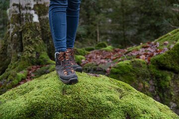 Hispanic woman walking through the forest in autumn