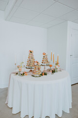 Macaroon Dessert Table with Candles and Florals