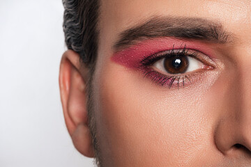Men's makeup look. Close-up portrait of a young bearded man. cosmetics for men.