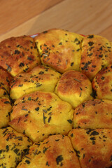 Turmeric curcuma and parsley bread . Healthy turmeric Bread in a cake pan on wooden table