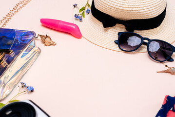 summer travel accessories. women's set of adult toys, camera, hat, glasses on a light background....